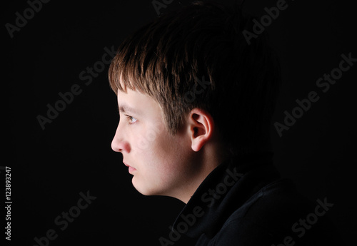 Profile of the sad boy