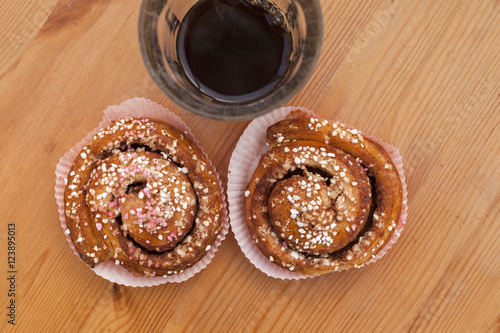 Fika coffee break of cinnamon bun and glass of coffee