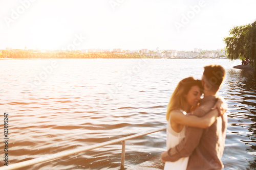 man and woman posing on the lake © teksomolika