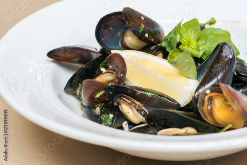 Steamed mussels in white wine sauce
 #123896405