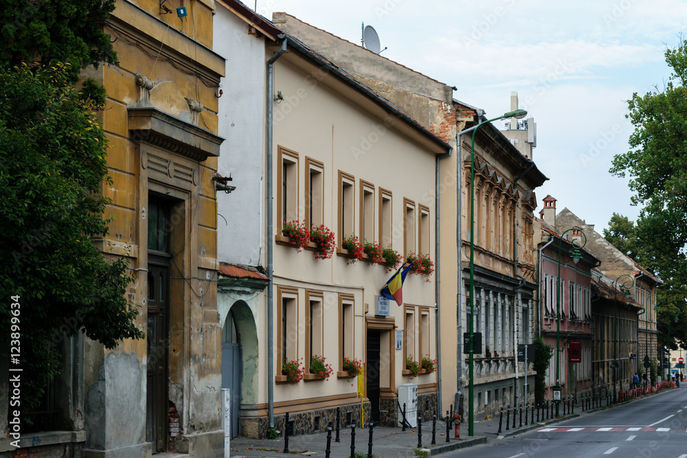 Old and new buildings on street in Brasov, Romania, Transylvania
