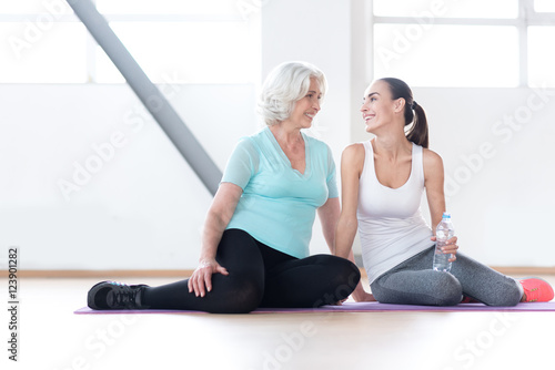 Good looking joyful women resting during their aerobic classes