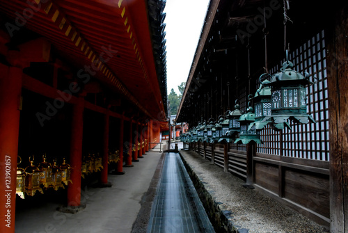 Long walkway between Japanese lanterns hanging