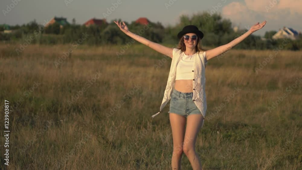 Young beautiful woman model walking on the meadow and enjoying the nature 4K Young beautiful woman model walking on the meadow and enjoying the nature 4K