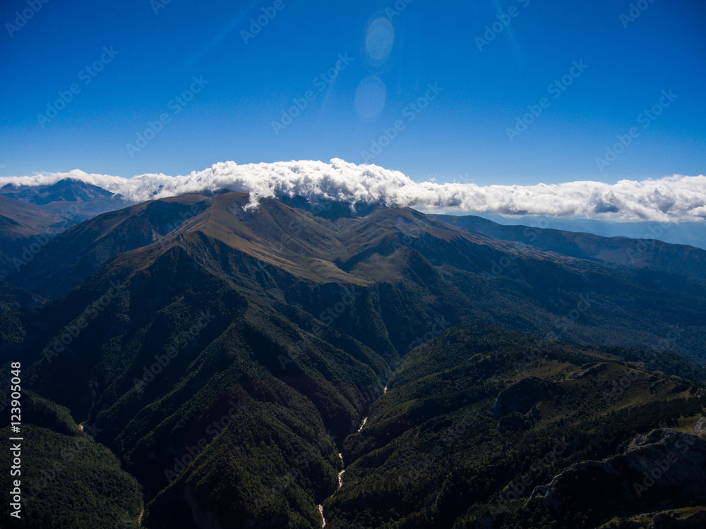 Aerial landscape of grand mountain valley with a river.