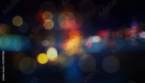 Colorful defocused bokeh lights in blur night background photo