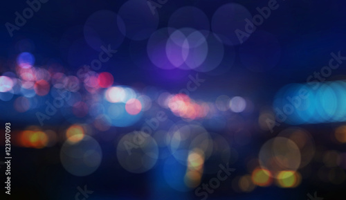 Colorful defocused bokeh lights in blur night background photo