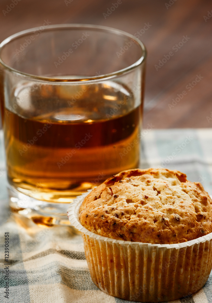 pastry, one muffin, a glass of apple juice on the table. Close-up pastry, one muffin, a glass of apple juice on the table. Close-up