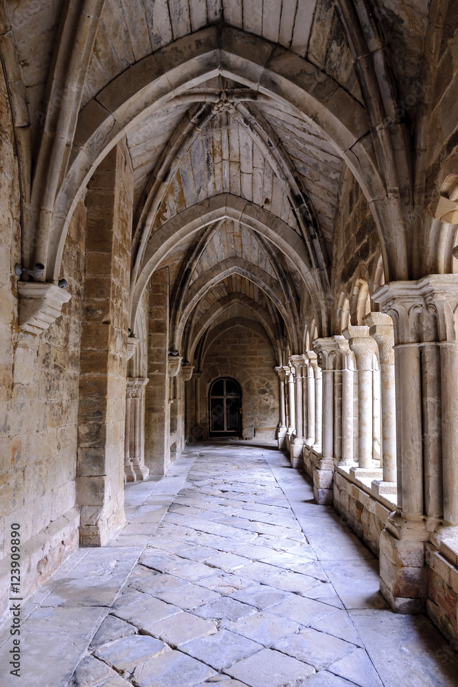 sight of the galleries of the cloister with arches, props and columns of the Romanesque abbey of Santa Maria the Real one in aguilar of Campoo, Palencia, Spain