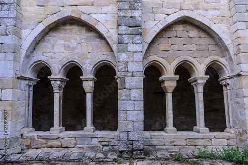 sight of the columns, arches and capitals of the courtyard of the cloister of the Romanesque abbey of Santa Maria the Real one in aguilar of Campoo, Palencia, Spain