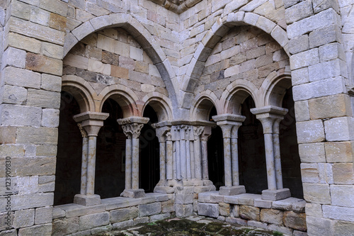 sight of the columns, arches and capitals of the courtyard of the cloister of the Romanesque abbey of Santa Maria the Real one in aguilar of Campoo, Palencia, Spain