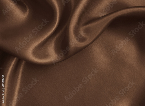 Smooth elegant golden silk or satin texture as background. In Se