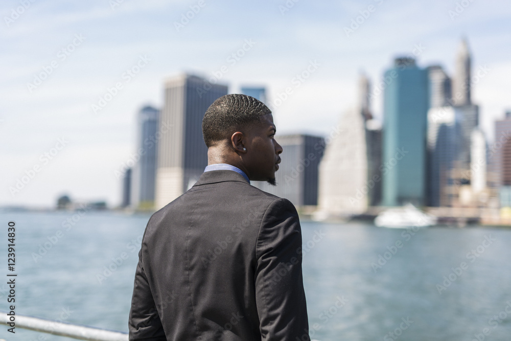 USA, Brooklyn, businessman looking at skyline of Manhattan USA, Brooklyn, businessman looking at skyline of Manhattan