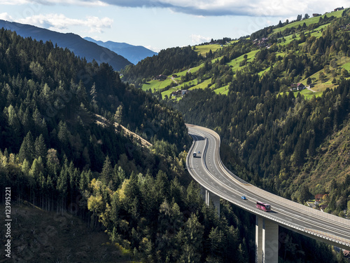 Tauernautobahn leading along hills and woods, Salzburg, Austria photo