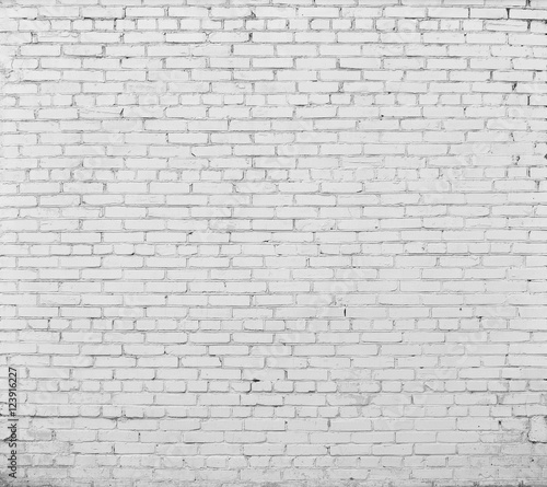 Brick wall painted with white paint.