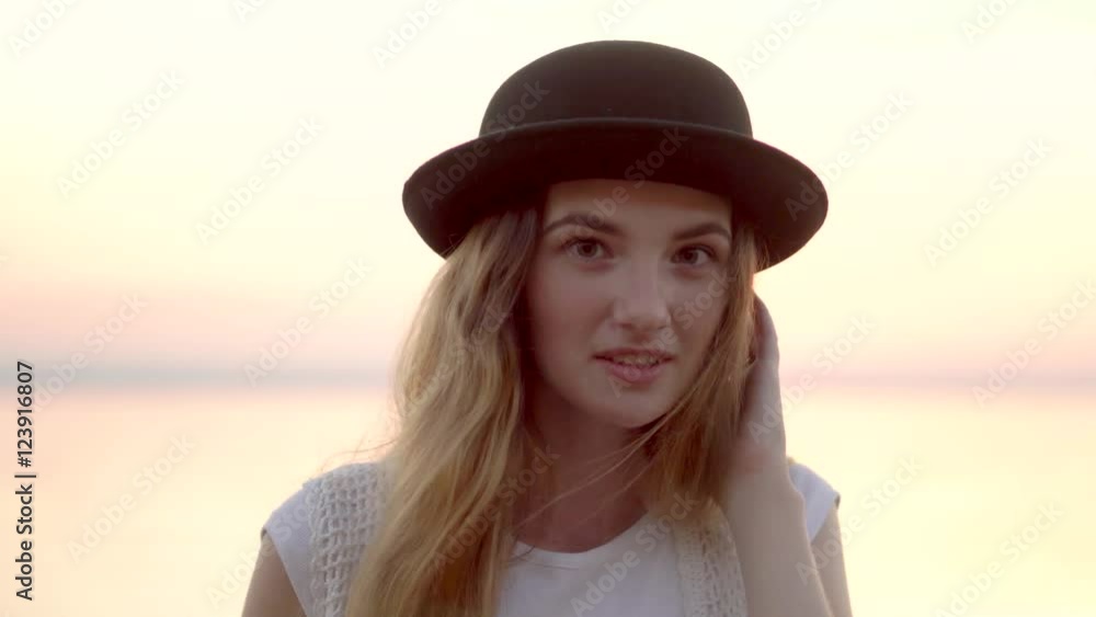 Close up portrait of pretty woman smiling at sunset sea background 4K Close up portrait of pretty woman smiling at sunset sea background 4K