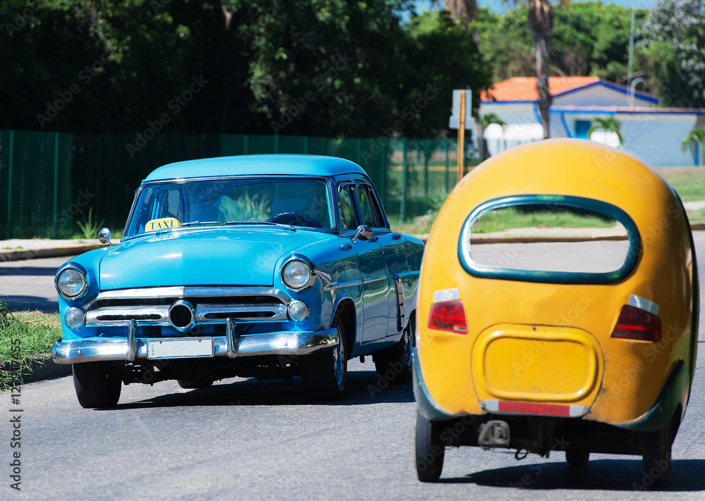 American Classic car und Coco Mobil on street in Havana Cuba