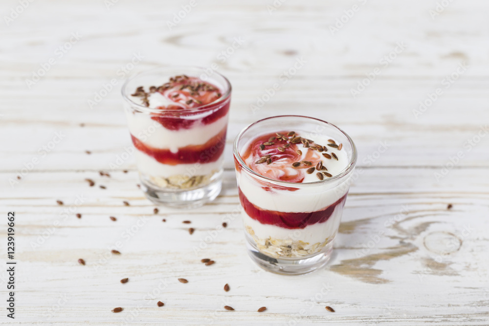 Homemade yogurt with berry jam, linseed and oat flakes Homemade yogurt with berry jam, linseed and oat flakes