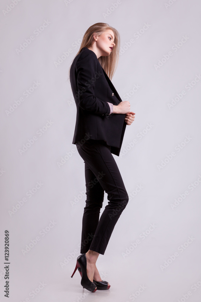 Model in business suit full body on gray background Model in business suit full body on gray background