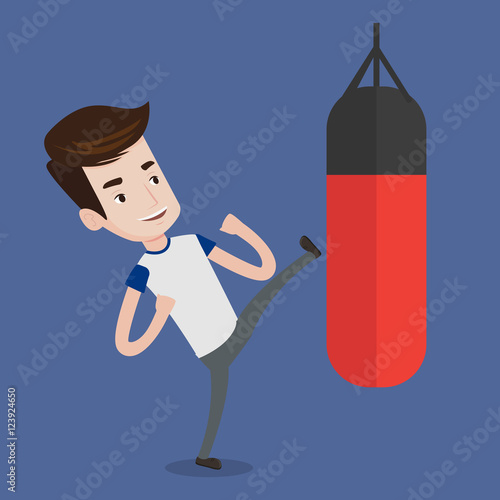 Man exercising with punching bag.