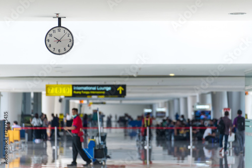 Departure lounge at the airport with traveller and luggage