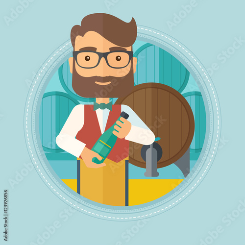 Waiter holding bottle in wine cellar.