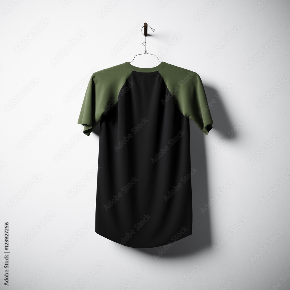 Blank black and green cotton tshirt hanging in center of empty concrete wall. Clear label mockup with highly detailed textured materials. Square. Back side view. 3D rendering. Blank black and green cotton tshirt hanging in center of empty concrete wall. Clear label mockup with highly detailed textured materials. Square. Back side view. 3D rendering.