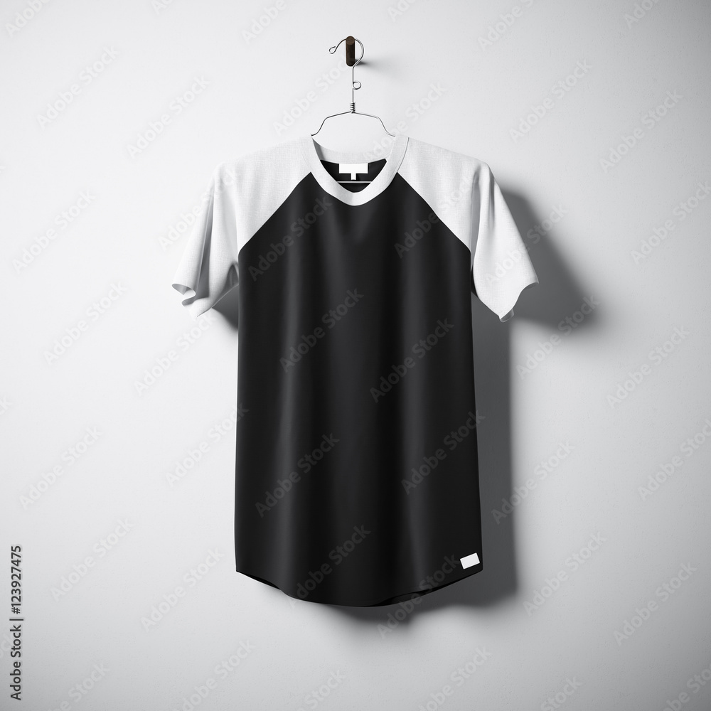 Blank cotton tshirt of white and black colors hanging in center empty concrete wall. Clear label mockup with highly detailed textured materials. Square. Front side view. 3D rendering. Blank cotton tshirt of white and black colors hanging in center empty concrete wall. Clear label mockup with highly detailed textured materials. Square. Front side view. 3D rendering.