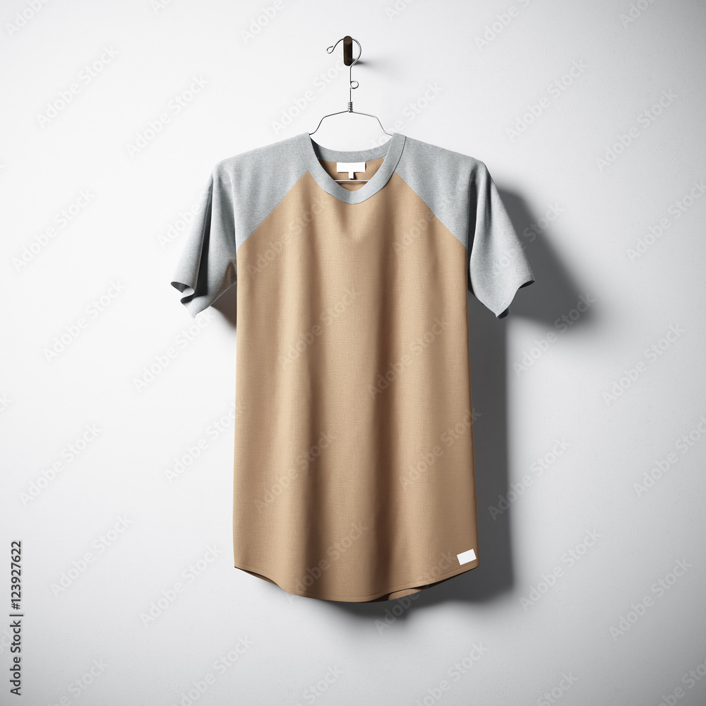 Blank multicolor cotton tshirt hanging in center of empty concrete wall. Clear label mockup with highly detailed textured materials. Square. Front side view. 3D rendering. Blank multicolor cotton tshirt hanging in center of empty concrete wall. Clear label mockup with highly detailed textured materials. Square. Front side view. 3D rendering.