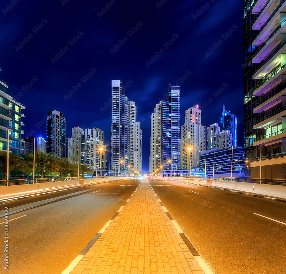 Fototapeta premium Panoramic view of Dubai Marina bay with yacht and cloudy sky, Dubai, UAE