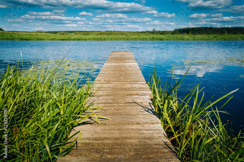 River landscape wooden pier. Horizon