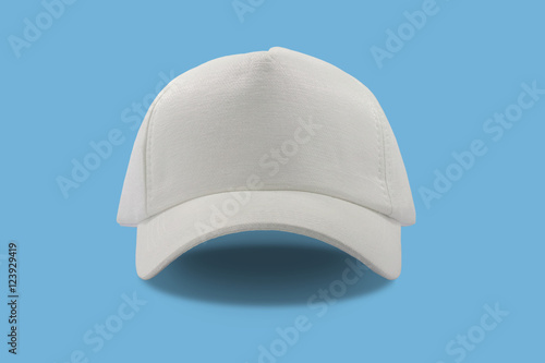 Closeup of the fashion white cap isolated on blue background.
