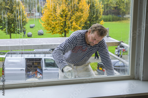 Принти на полотні Painting a house on the outside