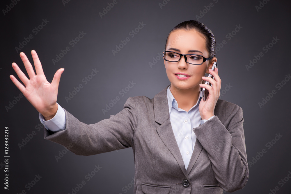 Businesswoman using mobile phone in business concept Businesswoman using mobile phone in business concept