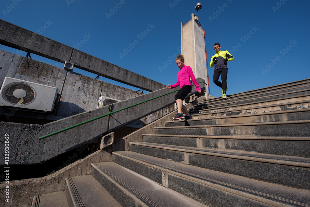 Fototapeta premium young couple jogging on steps