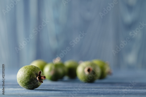 feijoa, pineapple guava on a dark wood background. selective foc © Andrey Cherkasov