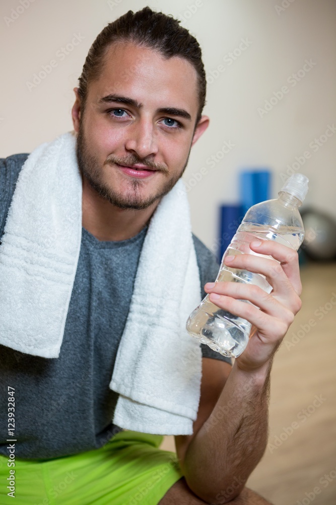 Portrait of confident man holding water bottle Portrait of confident man holding water bottle