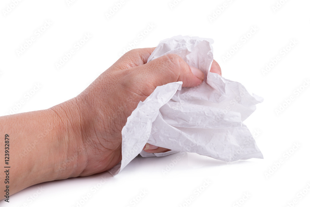 hand squeezing tissue paper isolated on white background. hand squeezing tissue paper isolated on white background.