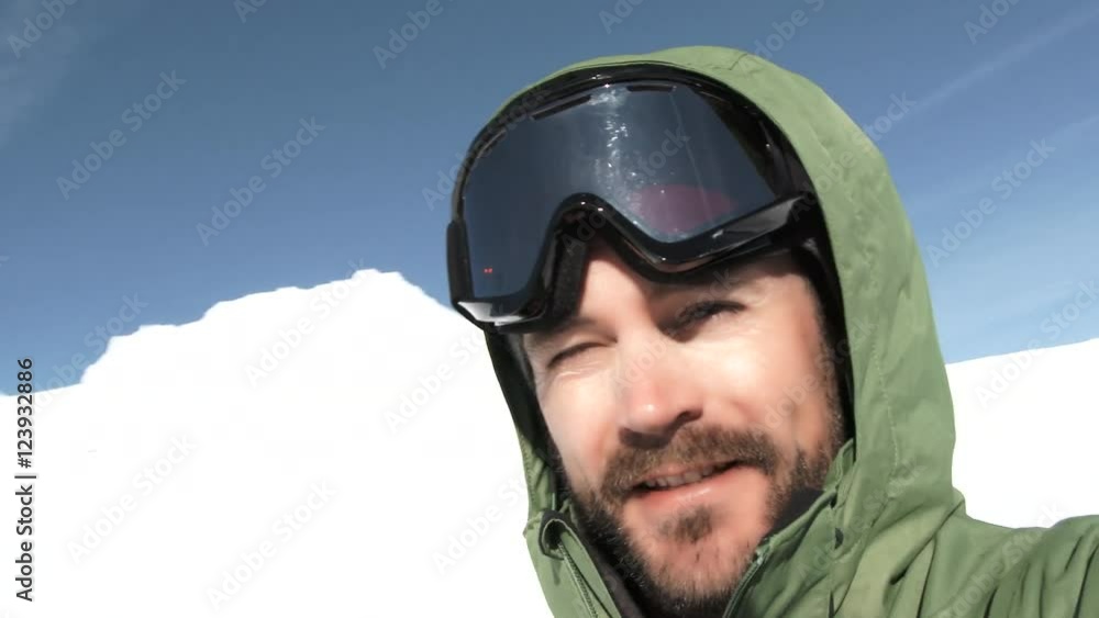 Model released man smiling while spinning around on Mt Hood in Oregon on beautiful day. Model released man smiling while spinning around on Mt Hood in Oregon on beautiful day.
