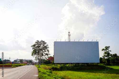 Big blanked bilboard on field at country roadside