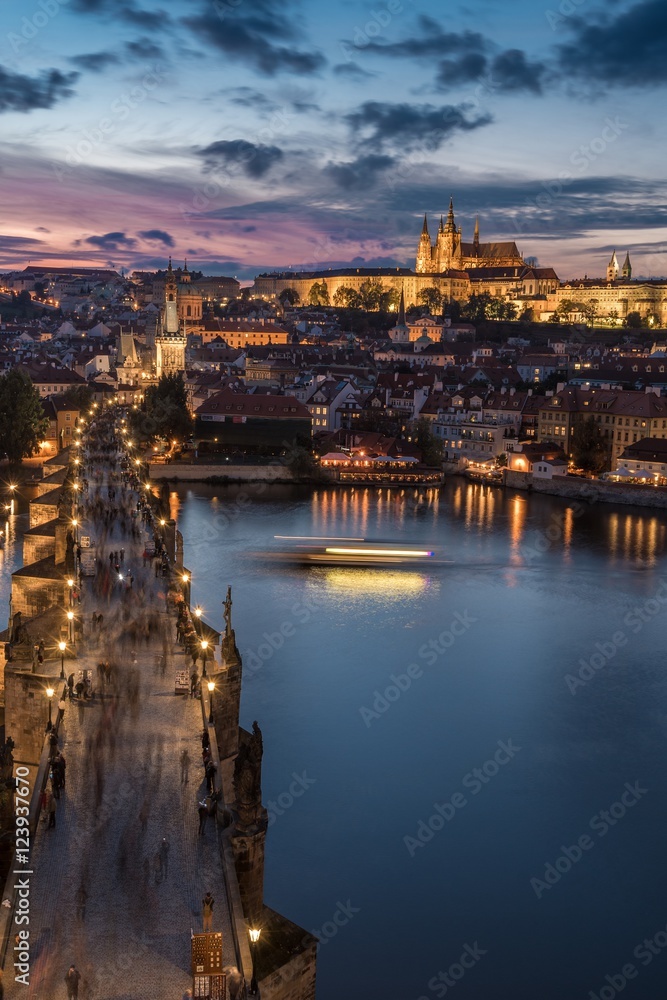 Stunning view over Charles Bridge and Castle in Prague Czech Republic during sunset from above.