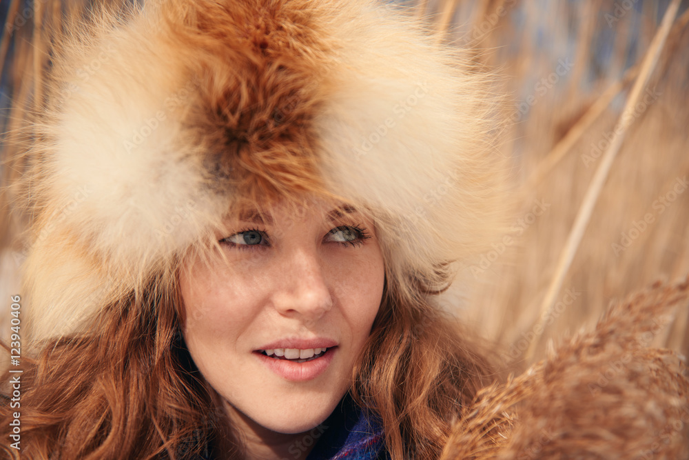 Portrait of one young woman in a meadow in winter Portrait of one young woman in a meadow in winter