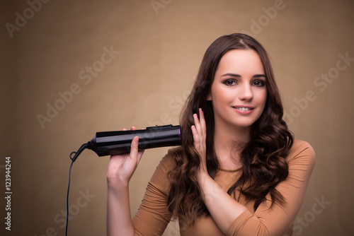 Beautiful woman with hair dryer