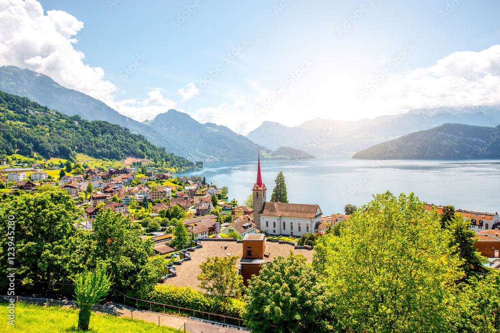 Landscape view on Weggis village on Lucerne lake with beautiful mountains on the background in Switzerland