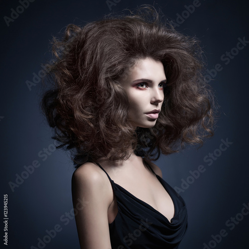 Beautiful woman with volume wavy hair