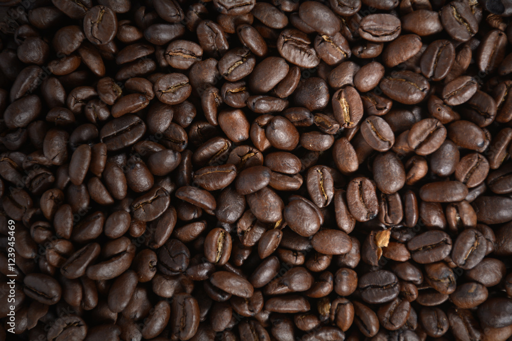Coffee beans on wood Coffee beans on wood