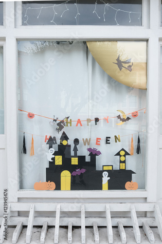 San francisco, USA - October 13, 2016: Cute kids paper crafts display at nursery house's window for celebrating on October 31, Halloween day.