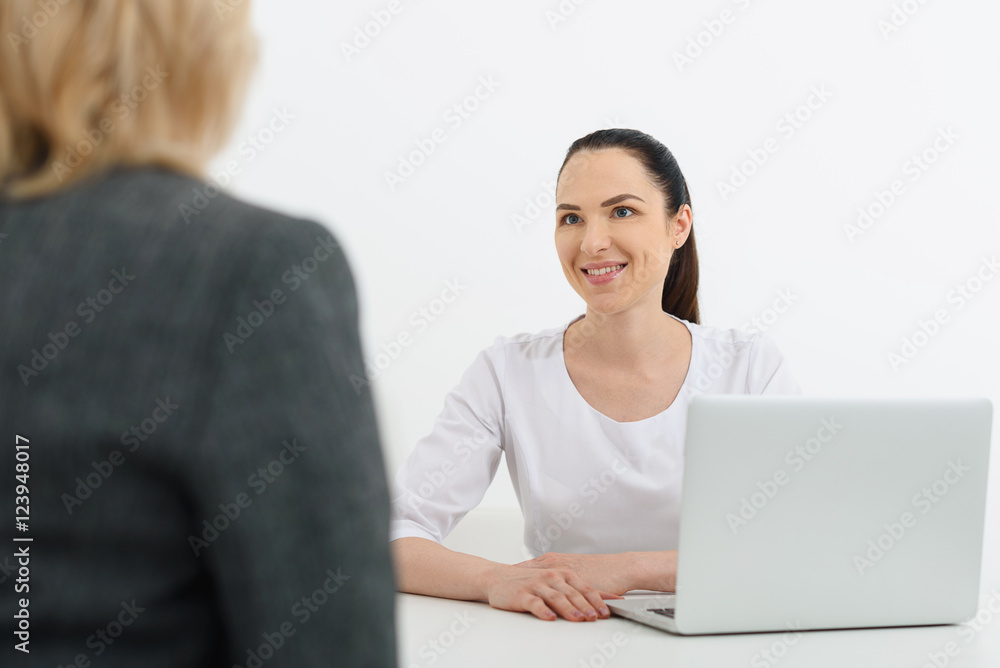 Polite doctor has discussion with senior lady Polite doctor has discussion with senior lady