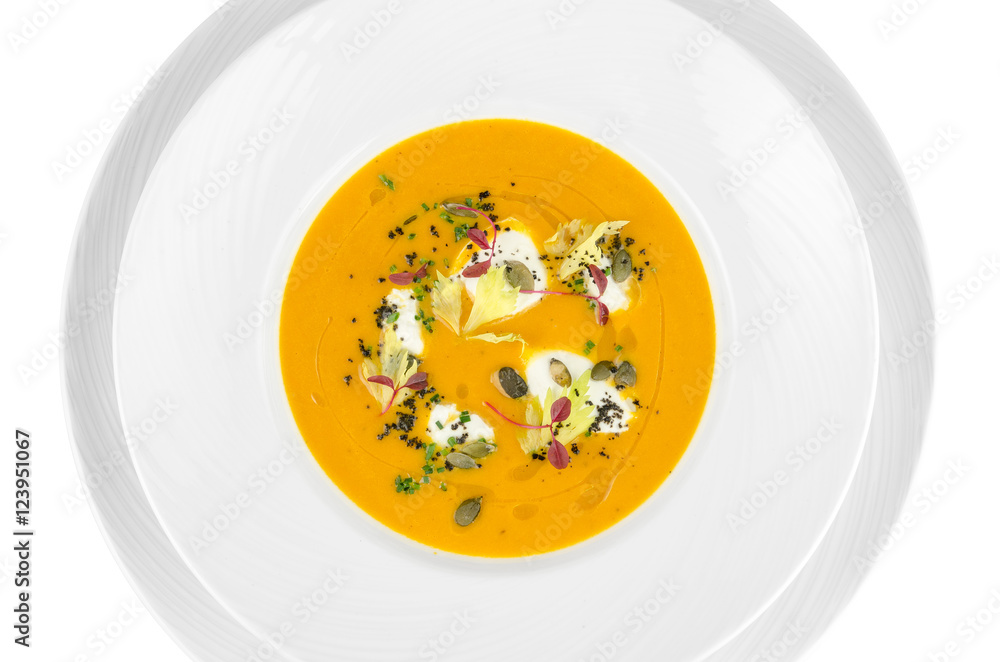 Pumpkin soup with cream cheese on a white background, top view Pumpkin soup with cream cheese on a white background, top view