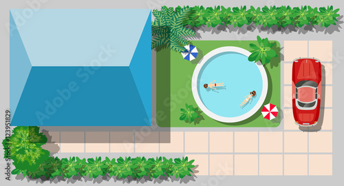 Top view of the swimming pool with beach umbrellas and vacationers people